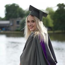 Caitlin Day in her graduation robes on graduation day. Caitlin is the winner of the Stowe Family Law Prize.